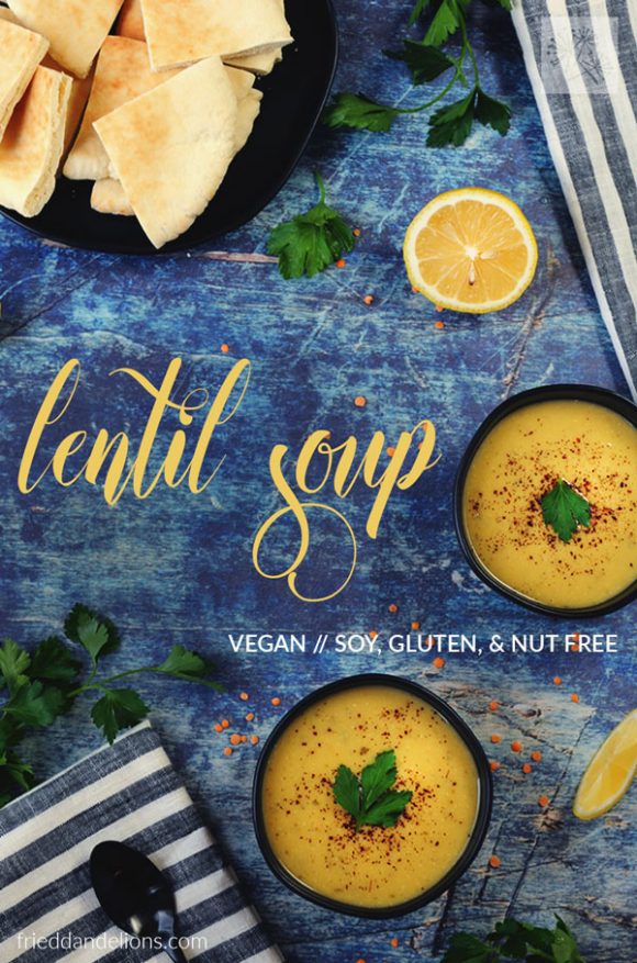 overhead view of two bowls of vegan lentil soup with blue background and letters overlaid