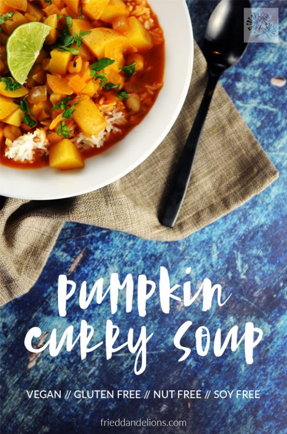 overhead view of pumpkin curry soup with text