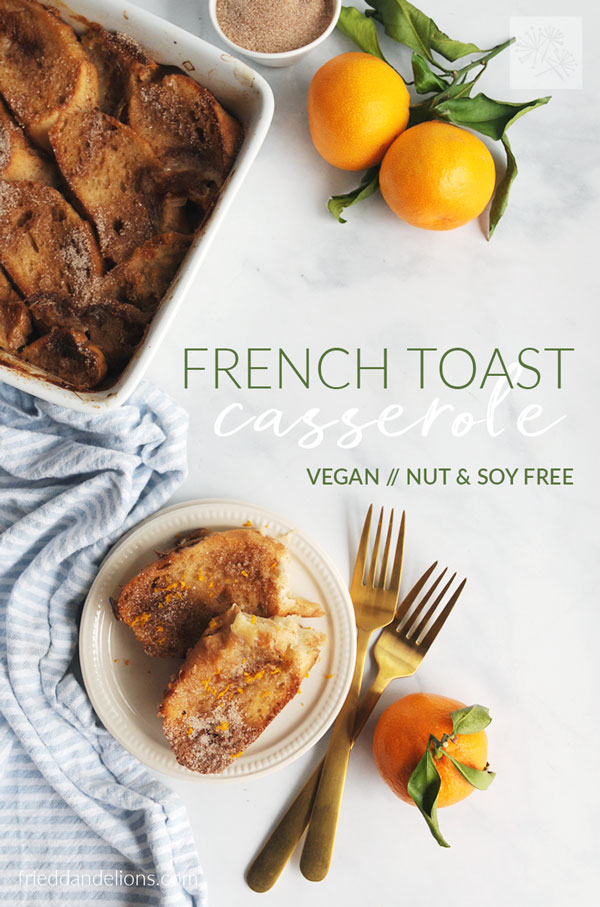 overhead view of plate of vegan french toast casserole with oranges in background, text overlay, gold forks