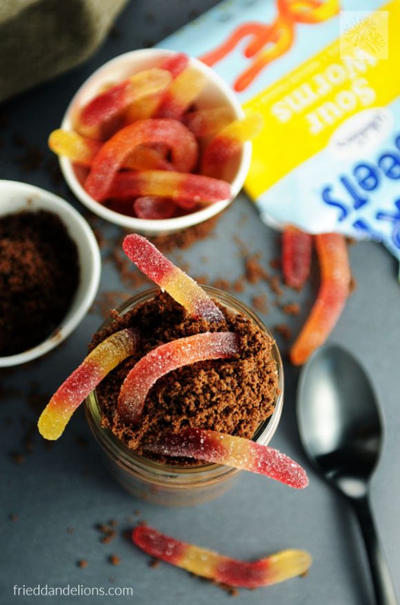 overhead view of vegan dirt cups with Surf Sweets sour worm bag in background