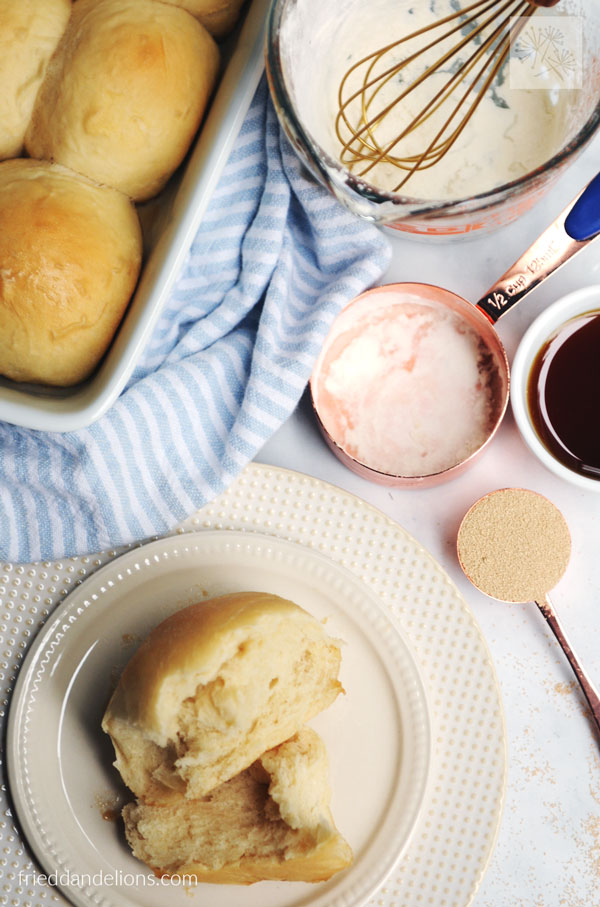 overhead view of maple dinner rolls with aquafaba with ingredients scattered in background