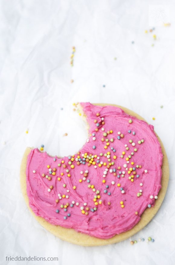 overhead of pink frosted sugar cookie with bite taken out, My Favorite Vegan Cookies
