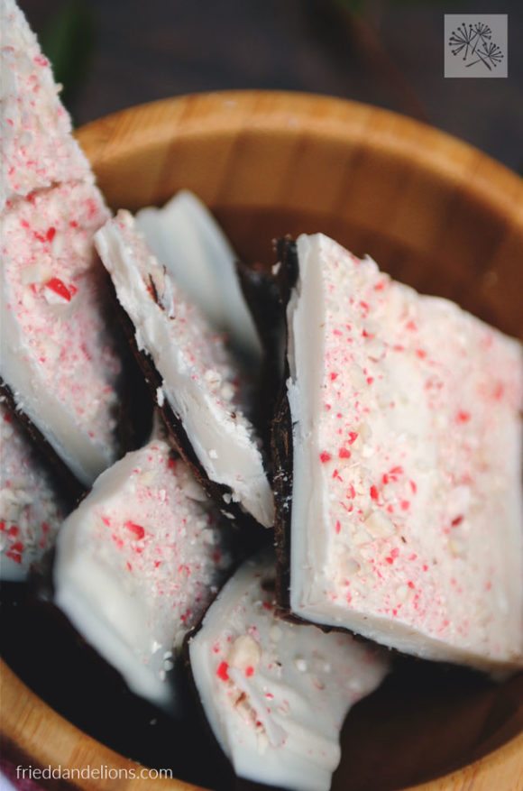 layers of dairy free peppermint bark in wooden bowl