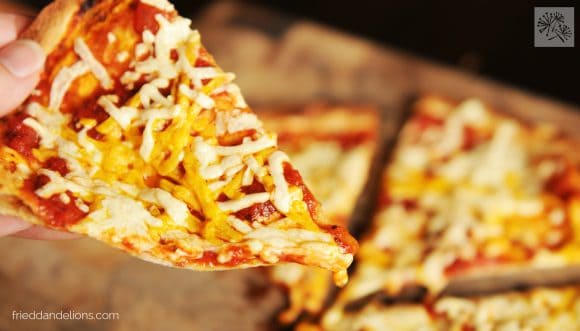 Cast iron skillet Tortilla Pizzas are so quick and easy to make! Have fun making custom flavors for everyone at your table! slice of Cast iron skillet Tortilla Pizza