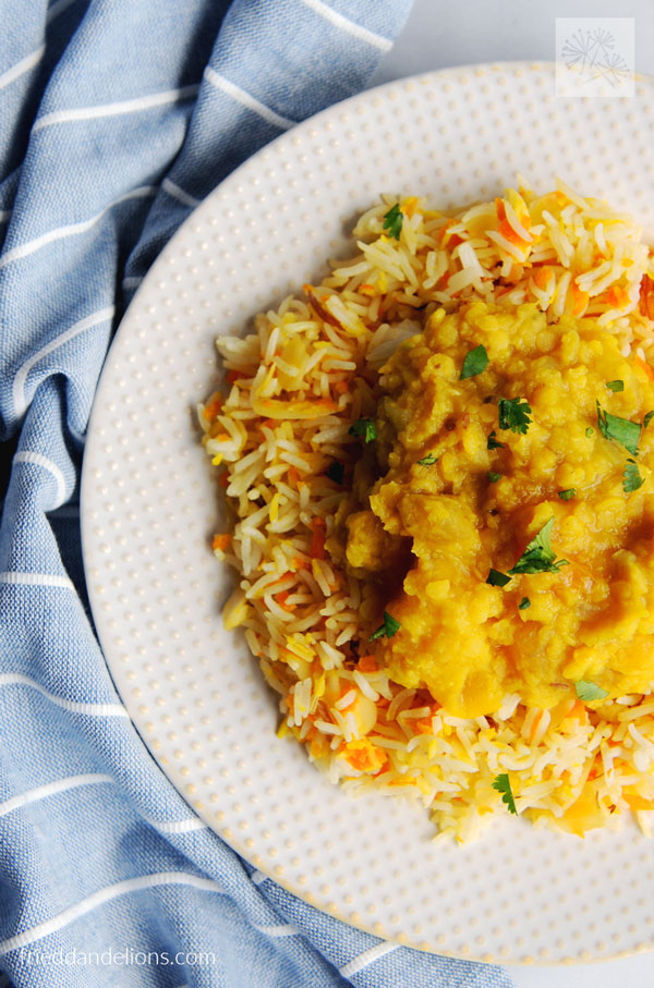 close up of plate of coconut carrot rice and mango dal