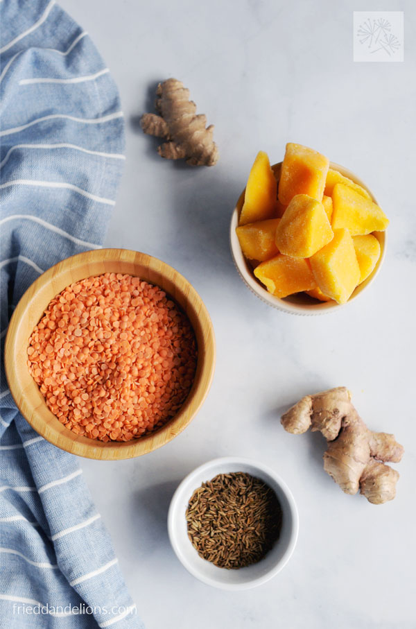 ingredients used to make mango dal—red lentils, ginger, mango, cumin seed