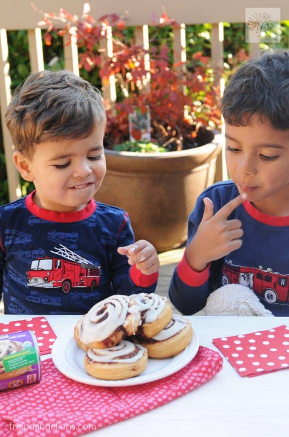 two young boys tasting Cinnamon Roll Bread Pudding