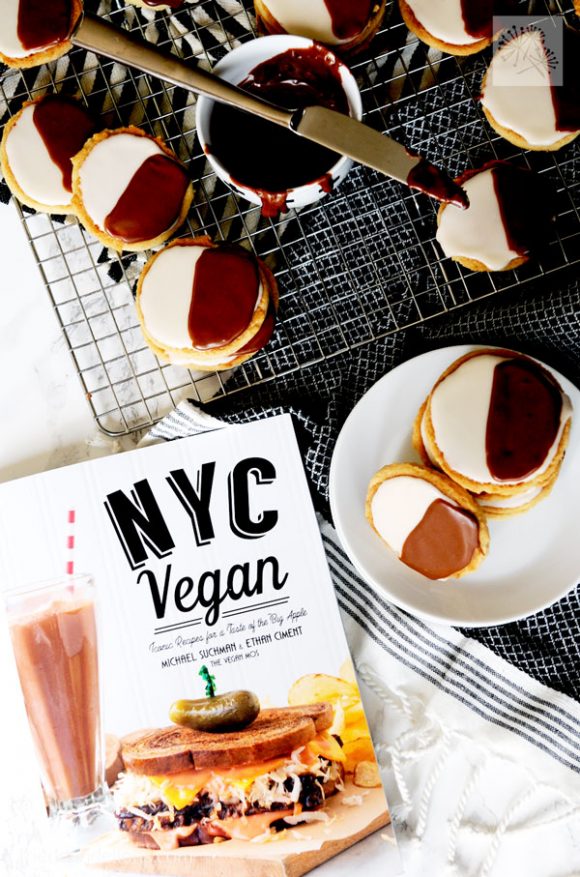 spread of black and white cookies with copy of NYC Vegan in foreground