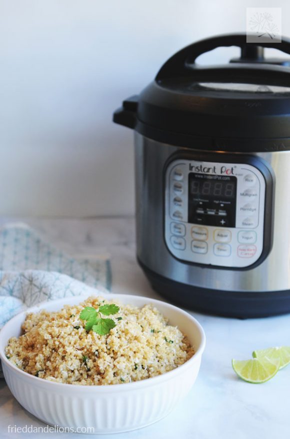 bowl of Instant Pot Quinoa in the foreground with Instant Pot in the background