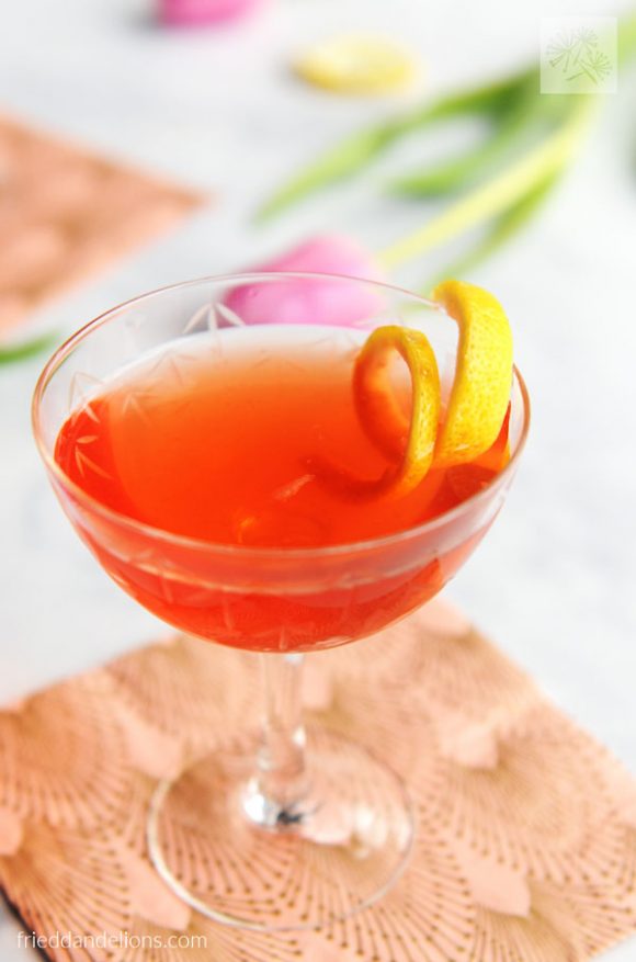close up of Rosé Vodka Cocktail with lemon twist