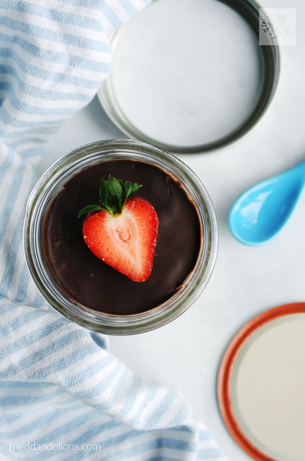 overhead view of vegan vanilla pudding cup with mason jar top in background