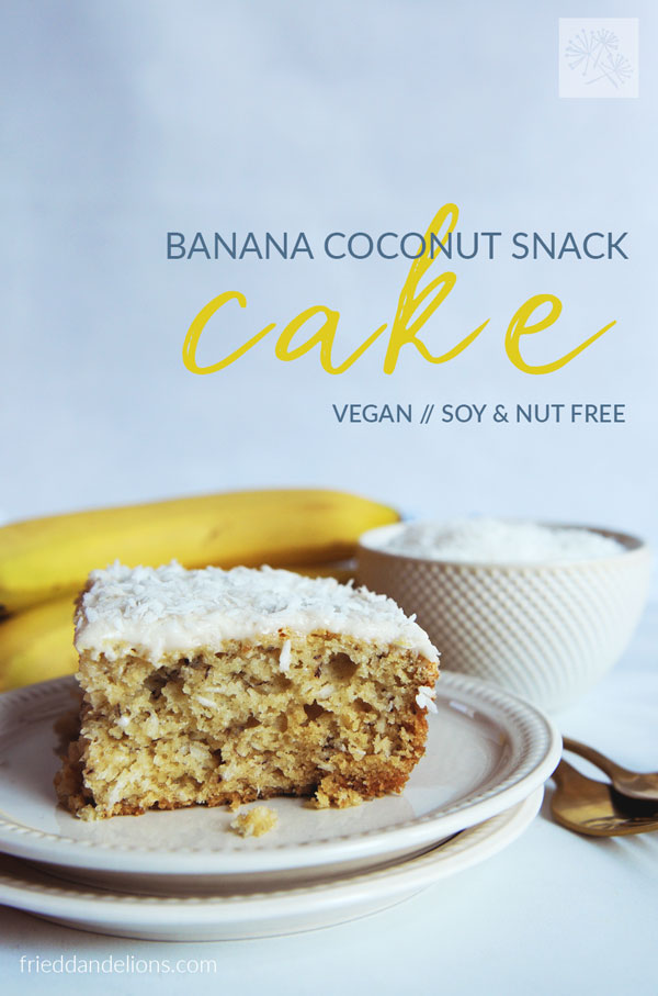 slice of banana coconut snack cake with bananas, bowl of coconut, silverware in background and text overlay