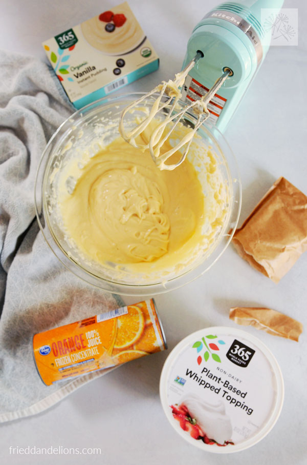 ingredients to make vegan whipped cream fruit dip with handheld mixer
